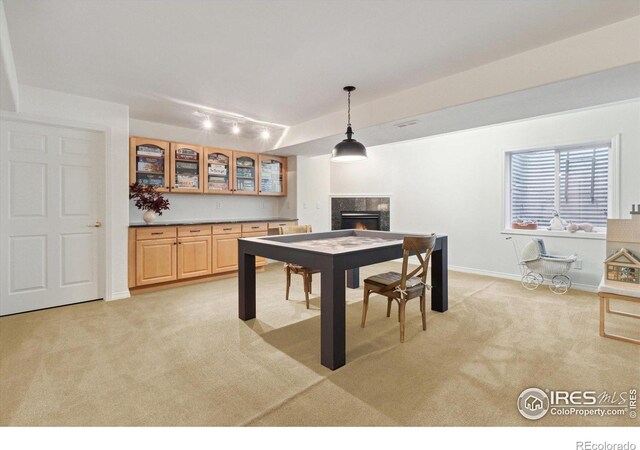 3931 Stonegrass Pt, Broomfield, CO 80023 - game room with light colored carpet and a high end fireplace