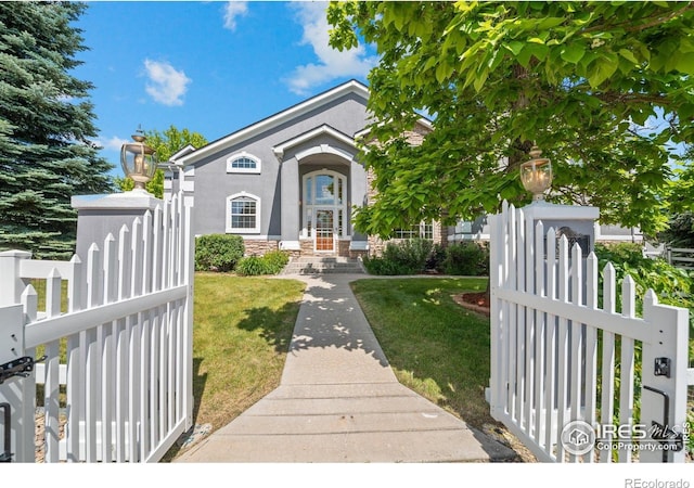 5753 Secrest Ct, Golden, CO 80403 - view of front of house featuring a gate and stucco siding