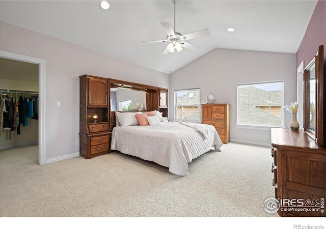 5753 Secrest Ct, Golden, CO 80403 - bedroom with light carpet, a walk in closet, vaulted ceiling, ceiling fan, and a closet