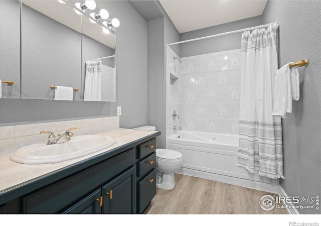 5753 Secrest Ct, Golden, CO 80403 - full bath featuring wood finished floors, vanity, and shower / bath combination with curtain