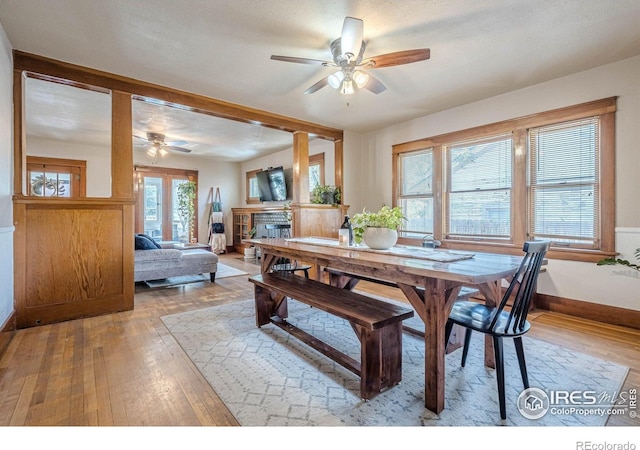 1421 N 7th St, Grand Junction, CO 81501 - dining area featuring a ceiling fan, hardwood / wood-style flooring, and a fireplace