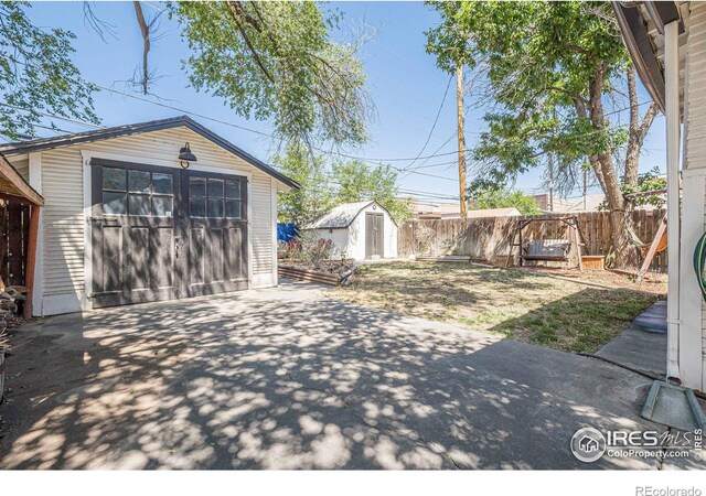1421 N 7th St, Grand Junction, CO 81501 - fenced backyard featuring a patio, driveway, and a shed