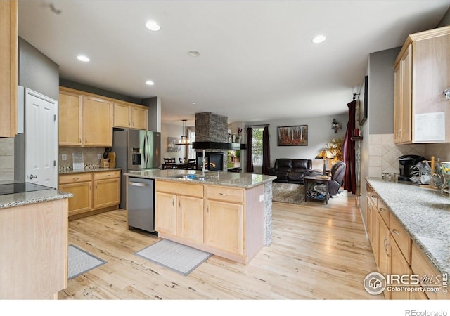 13266 Teller Lake Way, Broomfield, CO 80020 - kitchen featuring light brown cabinetry, dishwasher, light wood finished floors, open floor plan, and recessed lighting