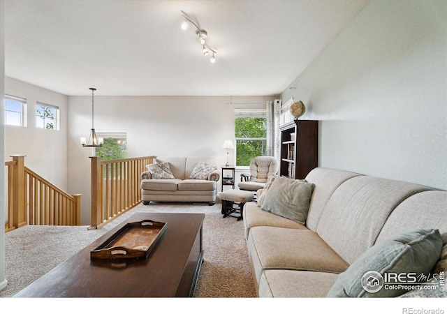 13266 Teller Lake Way, Broomfield, CO 80020 - living room with carpet, plenty of natural light, and a chandelier