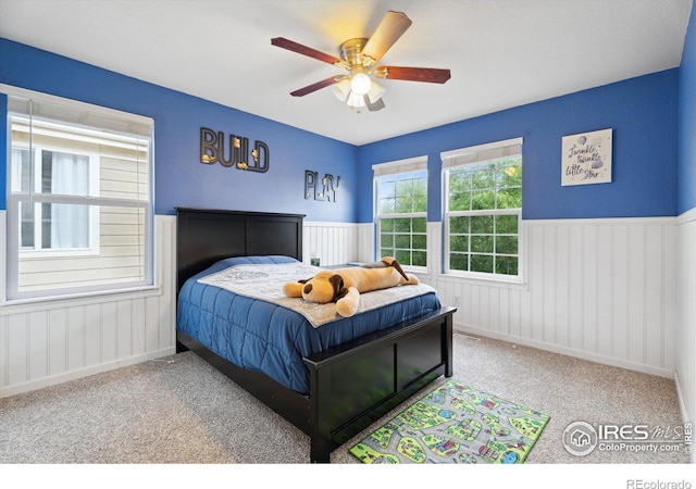 13266 Teller Lake Way, Broomfield, CO 80020 - carpeted bedroom featuring wainscoting and a ceiling fan