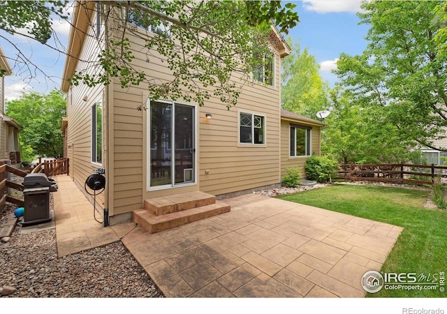 13266 Teller Lake Way, Broomfield, CO 80020 - fenced backyard featuring a patio and a grill