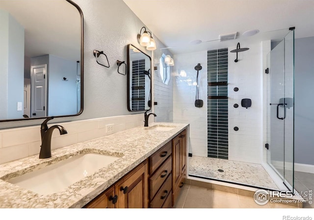 1616 Cedarwood Dr, Longmont, CO 80504 - bathroom with a shower stall, double vanity, and tile patterned flooring