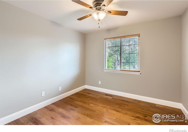 1616 Cedarwood Dr, Longmont, CO 80504 - spare room with ceiling fan and wood finished floors