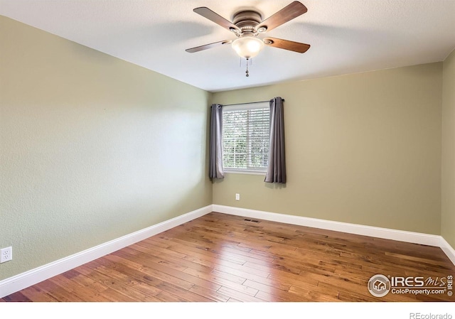 1616 Cedarwood Dr, Longmont, CO 80504 - unfurnished room with ceiling fan and wood finished floors