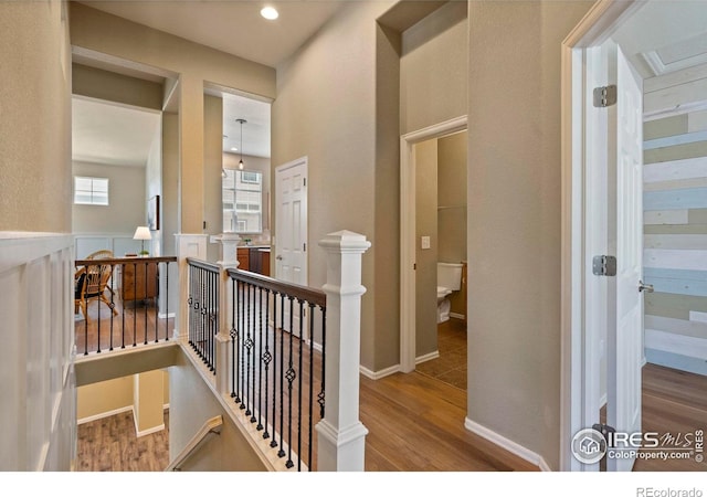 2833 Annelise Way, Fort Collins, CO 80525 - corridor featuring an upstairs landing, wood finished floors, and recessed lighting