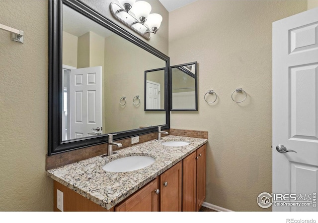 2833 Annelise Way, Fort Collins, CO 80525 - bathroom with double vanity and a textured wall