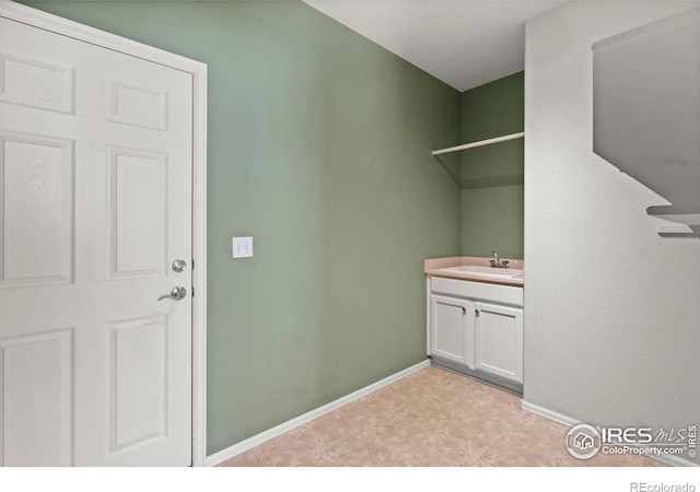 2833 Annelise Way, Fort Collins, CO 80525 - washroom featuring a sink and baseboards