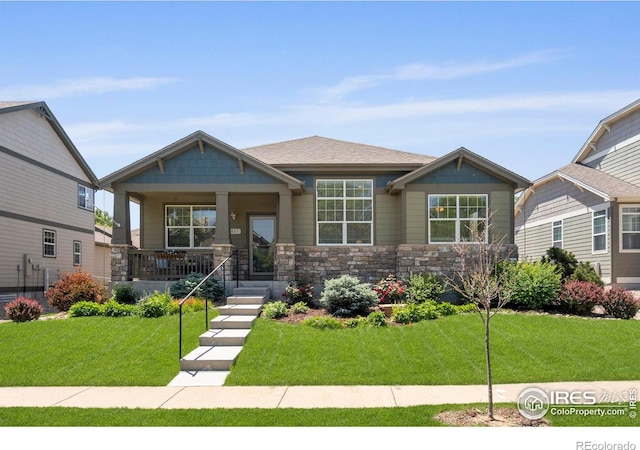 2833 Annelise Way, Fort Collins, CO 80525 - craftsman house with covered porch, a front lawn, and stone siding