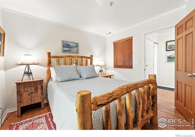 854 Walnut St Unit B, Boulder, CO 80302 - bedroom with ornamental molding and light wood-style floors