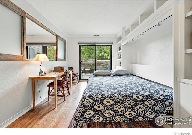 854 Walnut St Unit B, Boulder, CO 80302 - bedroom featuring access to exterior, light wood finished floors, crown molding, and a textured wall