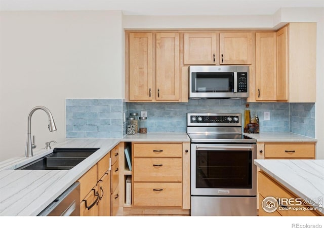 2016 Strathmore St, Louisville, CO 80027 - kitchen with stainless steel appliances, light brown cabinets, decorative backsplash, and light stone counters