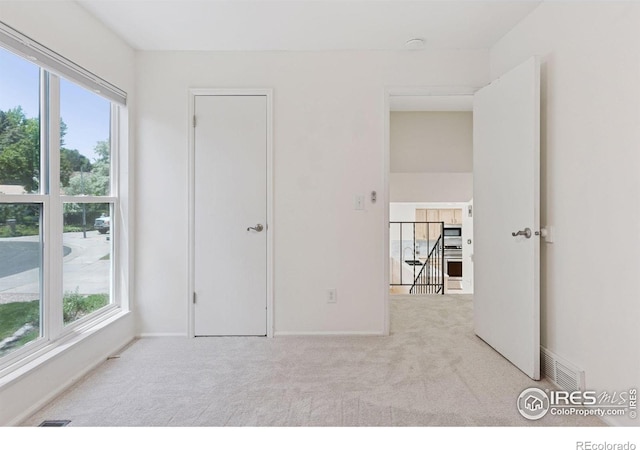 2016 Strathmore St, Louisville, CO 80027 - unfurnished room featuring carpet floors and healthy amount of natural light