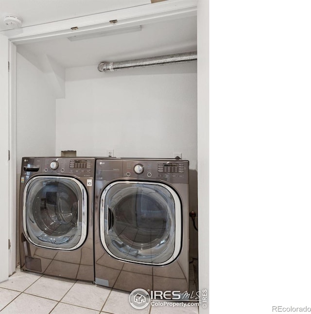 2016 Strathmore St, Louisville, CO 80027 - washroom featuring washer and clothes dryer and tile patterned floors