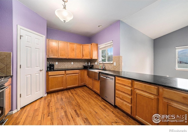 9673 Roadrunner Ave, Firestone, CO 80504 - kitchen featuring stainless steel dishwasher, light wood-type flooring, decorative backsplash, and decorative light fixtures