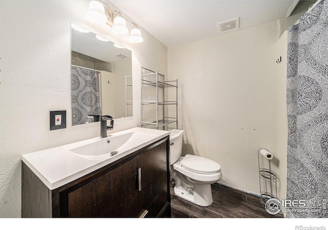 9673 Roadrunner Ave, Firestone, CO 80504 - bathroom featuring vanity, wood finished floors, and a shower with shower curtain