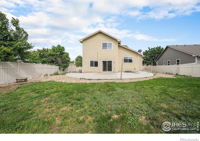 9673 Roadrunner Ave, Firestone, CO 80504 - rear view of house featuring a patio area and a fenced backyard