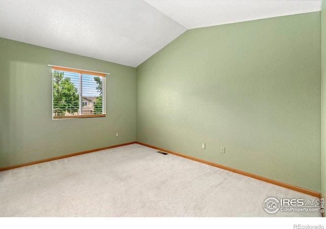 3350 Saratoga St Unit C, Wellington, CO 80549 - unfurnished room featuring carpet floors and vaulted ceiling