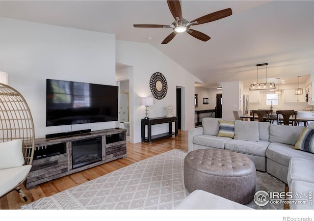 1250 Honeysuckle Ct, Windsor, CO 80550 - living room with wood finished floors, vaulted ceiling, and ceiling fan