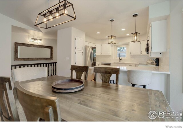 1250 Honeysuckle Ct, Windsor, CO 80550 - dining space with a chandelier and recessed lighting
