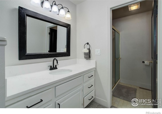1250 Honeysuckle Ct, Windsor, CO 80550 - bathroom with vanity, a shower stall, and tile patterned floors