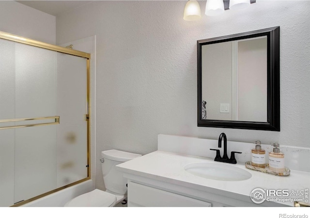 1250 Honeysuckle Ct, Windsor, CO 80550 - bathroom featuring vanity and bath / shower combo with glass door