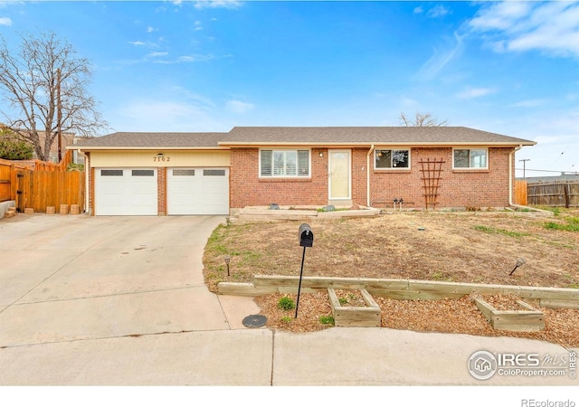 7162 Quay St, Arvada, CO 80003 - single story home with a garage, brick siding, and concrete driveway