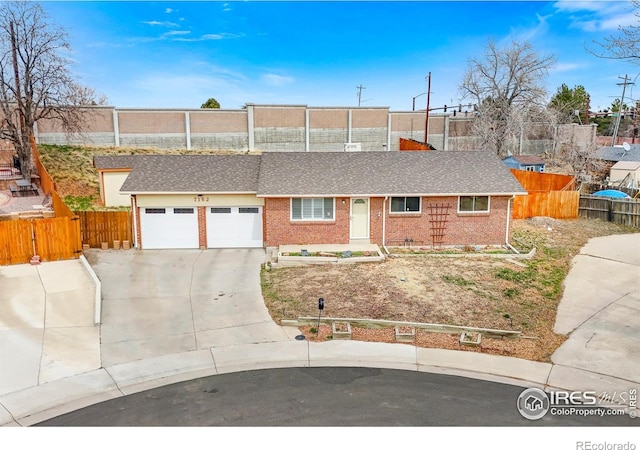 7162 Quay St, Arvada, CO 80003 - single story home with an attached garage, brick siding, driveway, and roof with shingles