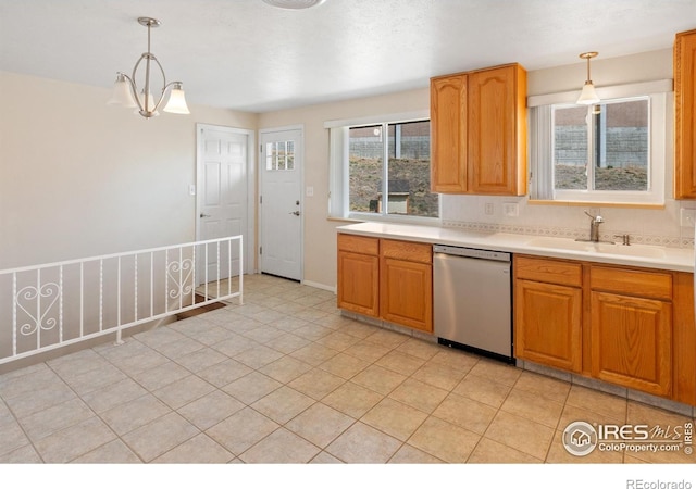 7162 Quay St, Arvada, CO 80003 - kitchen featuring stainless steel dishwasher, healthy amount of natural light, and pendant lighting