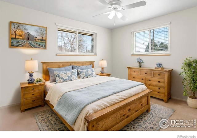 7162 Quay St, Arvada, CO 80003 - bedroom with multiple windows, light colored carpet, and ceiling fan