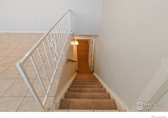 7162 Quay St, Arvada, CO 80003 - staircase featuring tile patterned floors