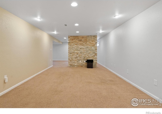 7162 Quay St, Arvada, CO 80003 - finished below grade area featuring carpet flooring, recessed lighting, and a fireplace