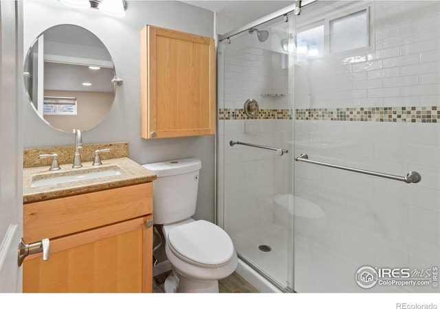 7162 Quay St, Arvada, CO 80003 - bathroom featuring vanity and a shower stall