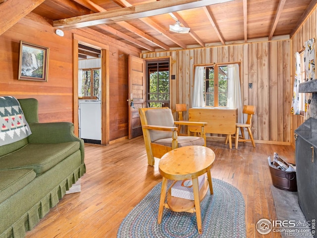 84 County Road 113 N, Allenspark, CO 80510 - living room with wooden walls, hardwood / wood-style floors, and a wooden ceiling with exposed beams