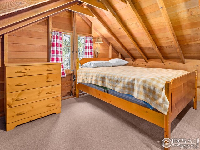84 County Road 113 N, Allenspark, CO 80510 - carpeted bedroom featuring vaulted ceiling, wooden ceiling, and wood walls