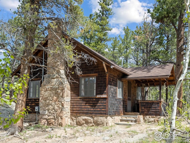84 County Road 113 N, Allenspark, CO 80510 - view of front of home featuring a shingled roof