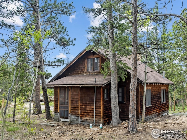 84 County Road 113 N, Allenspark, CO 80510 - view of side of property featuring a shingled roof