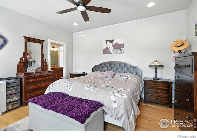 1101 Hillside Ln, Louisville, CO 80027 - bedroom featuring wood finished floors, recessed lighting, ceiling fan, and connected bathroom