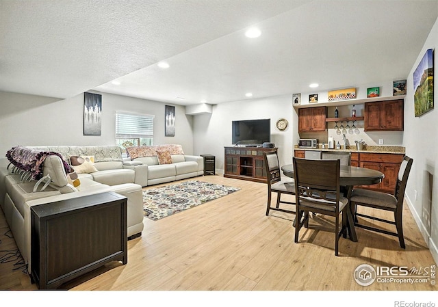 1101 Hillside Ln, Louisville, CO 80027 - living area with light wood-style flooring, bar, and recessed lighting