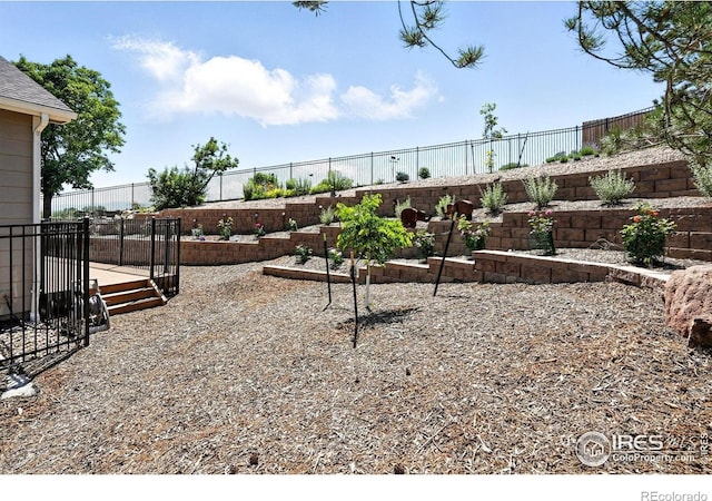 1101 Hillside Ln, Louisville, CO 80027 - fenced backyard with a wooden deck