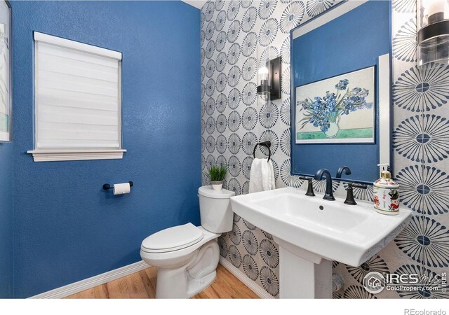 2006 Mackenzie Ct, Fort Collins, CO 80528 - bathroom with baseboards and wood finished floors