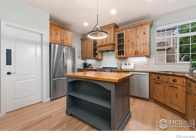 2006 Mackenzie Ct, Fort Collins, CO 80528 - kitchen with stainless steel appliances, butcher block counters, open shelves, light wood finished floors, and recessed lighting