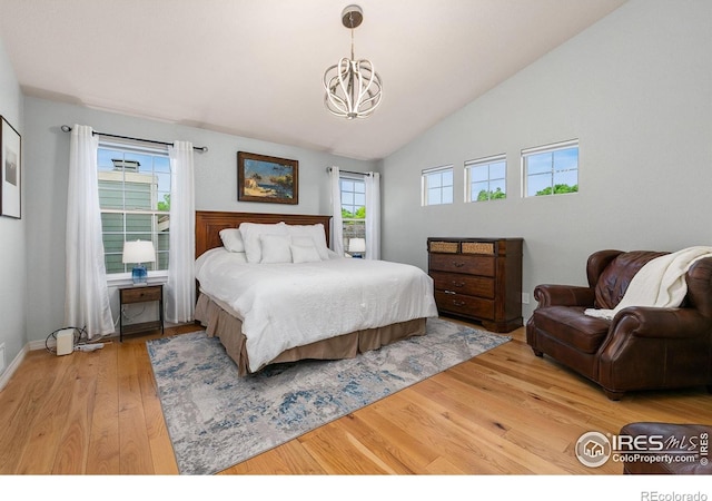 2006 Mackenzie Ct, Fort Collins, CO 80528 - bedroom featuring a chandelier, light wood-type flooring, and vaulted ceiling