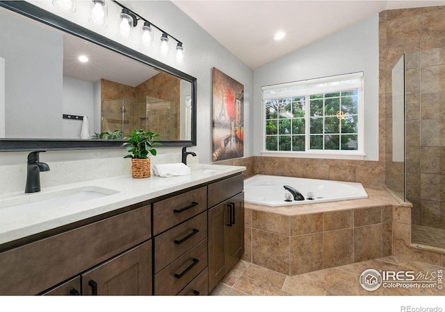 2006 Mackenzie Ct, Fort Collins, CO 80528 - full bathroom with lofted ceiling, a garden tub, double vanity, a tile shower, and recessed lighting