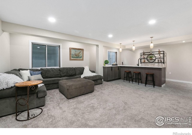 2006 Mackenzie Ct, Fort Collins, CO 80528 - living area with bar with sink, recessed lighting, and carpet