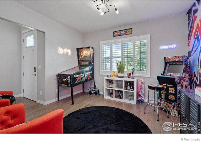 2332 Tabor St, Berthoud, CO 80513 - rec room with wood finished floors and baseboards
